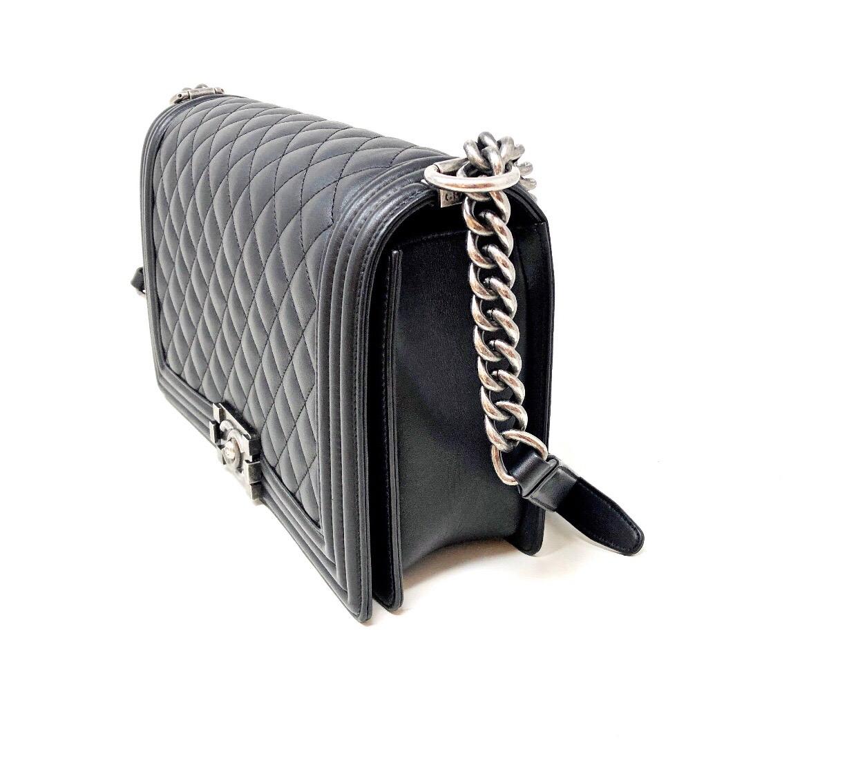 Chanel Boy Quilted Flap Bag Lambskin Medium, crafted from black quilted lambskin leather, features chain link strap with leather shoulder pad and aged silver-tone hardware. Year 2018 dust- bag card, box and original envoice included. 
Dimensions