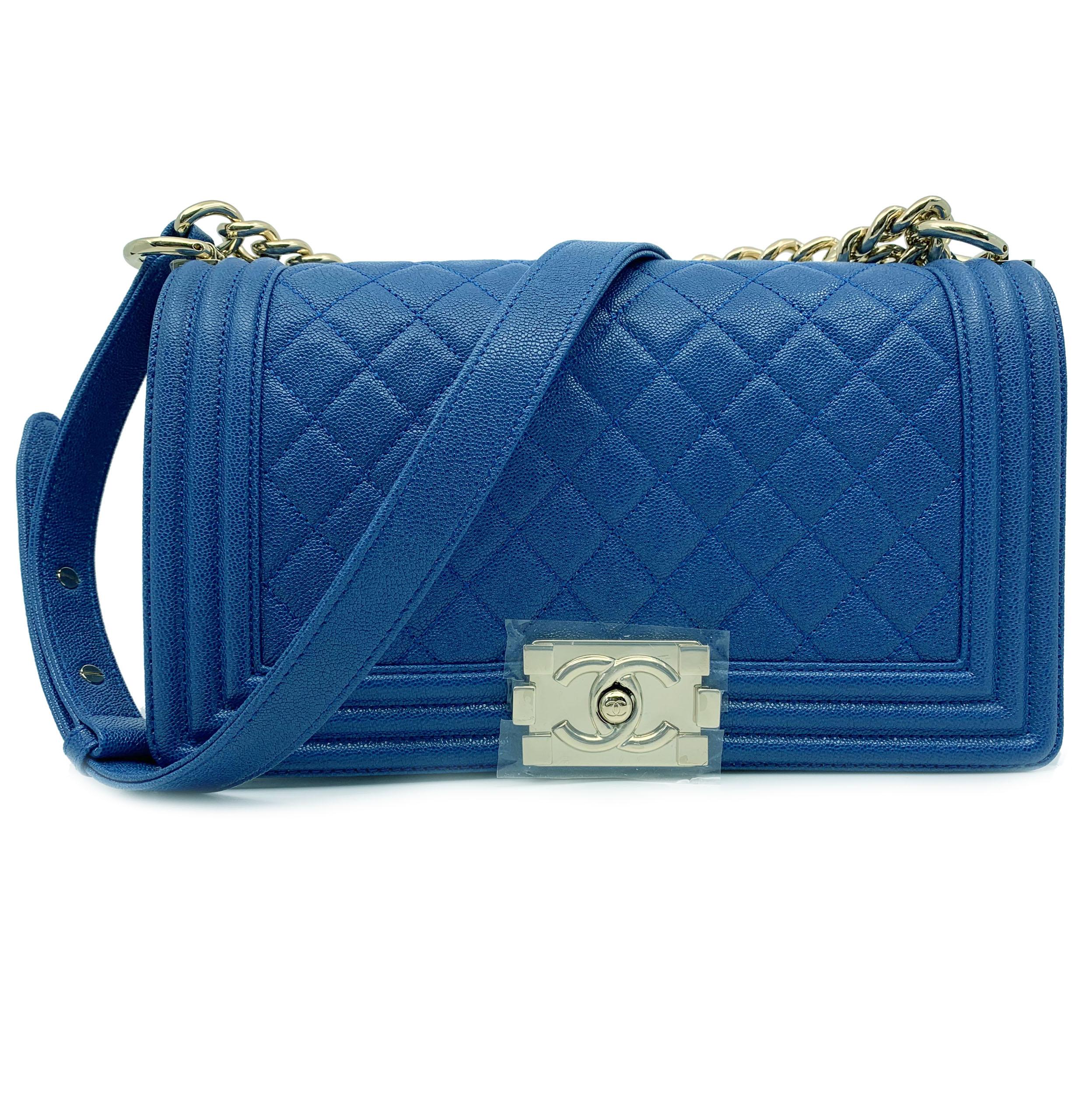 Very rare! Impeccable!

Chanel Boy Gold Tone Chain leather Blue Shoulder Ladies Bag A67086 B00317 N090

Comes Without Dust Bag.
Tags are attached. 
Champagne/Gold Color Hardware.
Strap: 20.5 inch 
Measurements: 10 inch x 6 inch x 2.75 inch
With box.