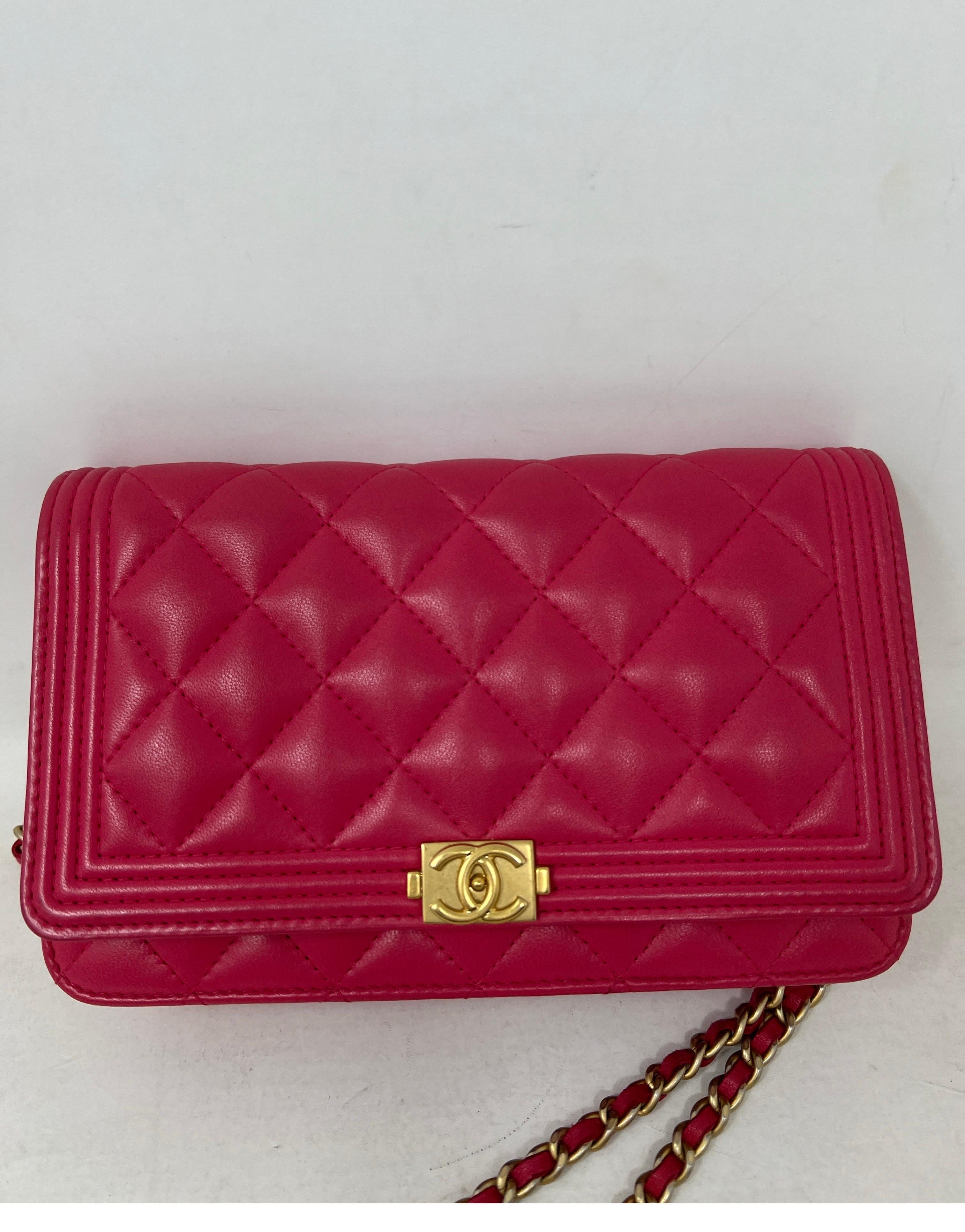 Chanel Hot Pink Wallet On A Chain Bag. Gold hardware. Can be worn as a crossbody bag. Interior is clean. Excellent like new condition. Includes dust bag and box. Guaranteed authentic. 