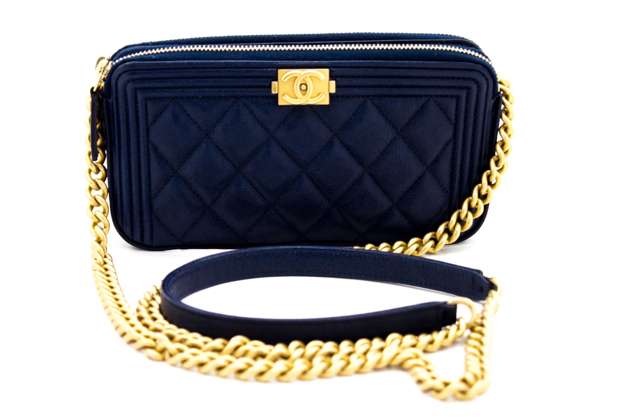 An authentic CHANEL Boy Navy Caviar Wallet On Chain WOC Double Zip Shoulder Bag. The color is Navy. The outside material is Leather. The pattern is Solid. This item is Contemporary. The year of manufacture would be 2019.
Conditions & Ratings
Outside