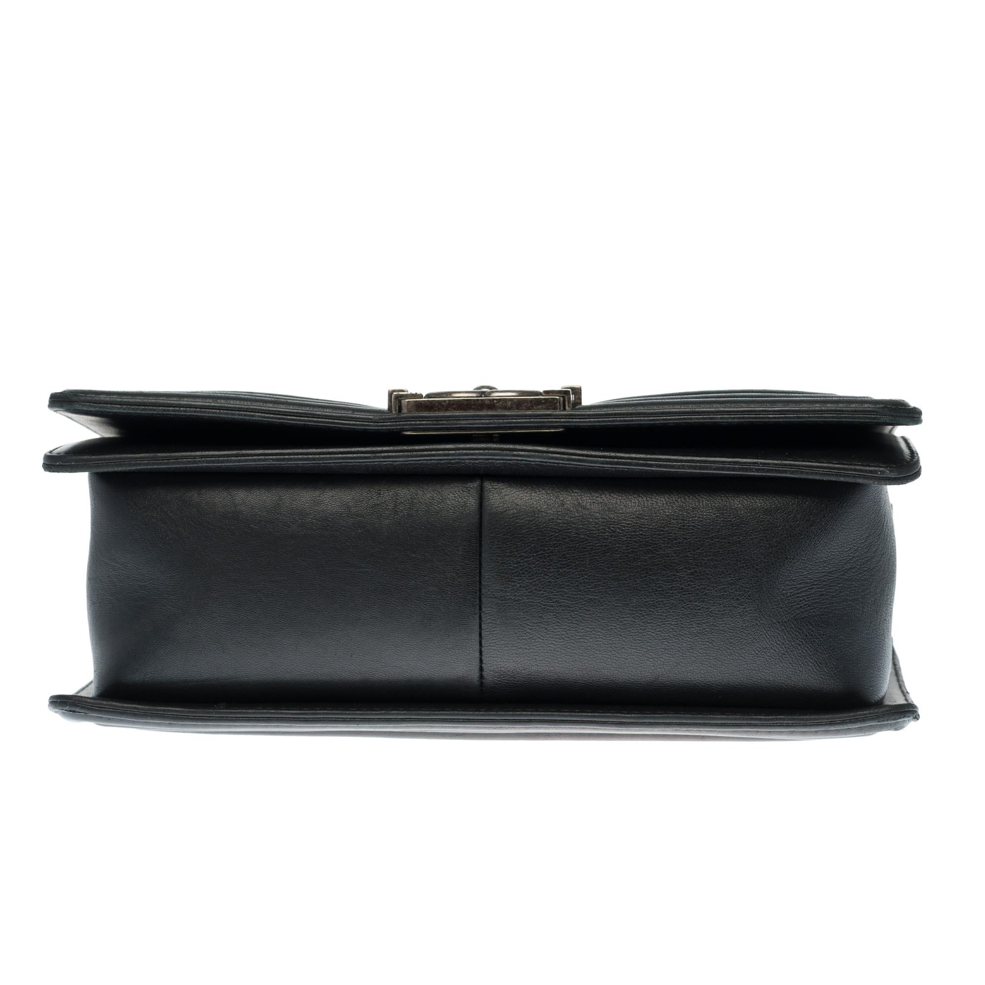 Chanel Boy Old medium shoulder bag in black quilted leather, silver hardware 1