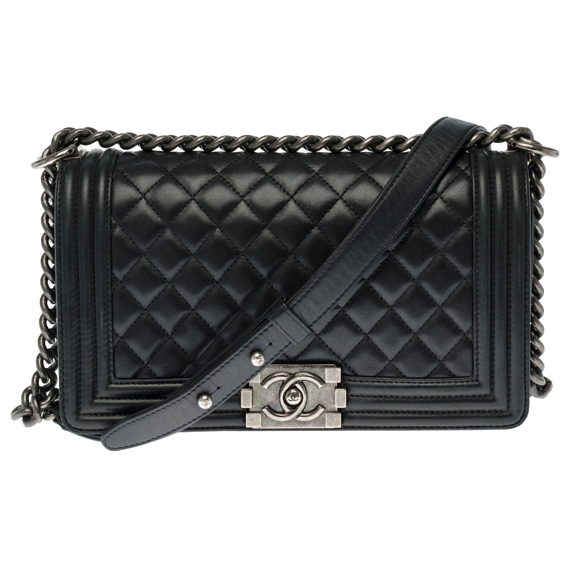 Chanel Boy Old medium shoulder bag in black quilted leather, silver hardware