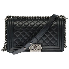 Chanel Boy Old medium shoulder bag in black quilted leather, silver hardware