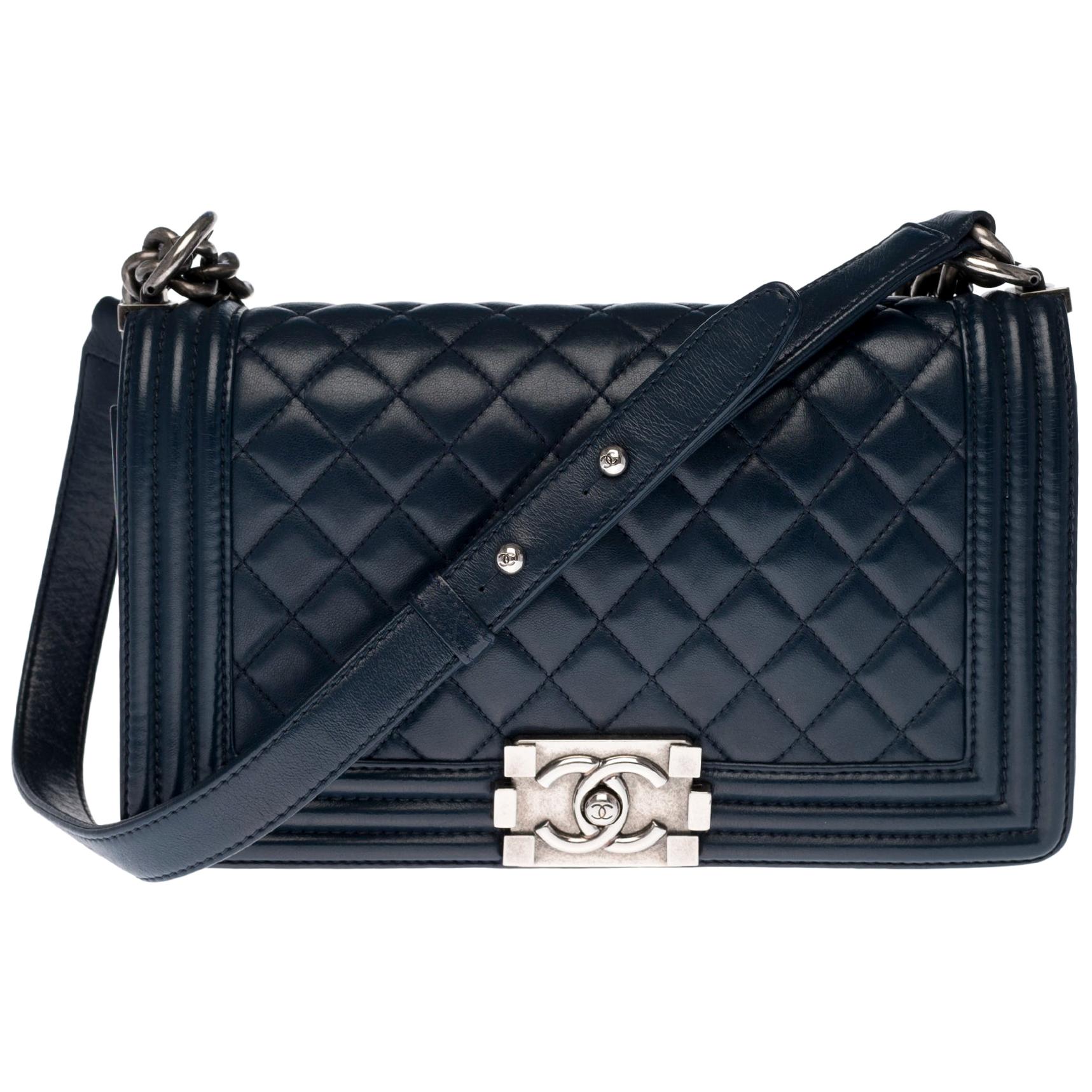 Chanel Boy Old medium shoulder bag in navy blue quilted leather, silver hardware