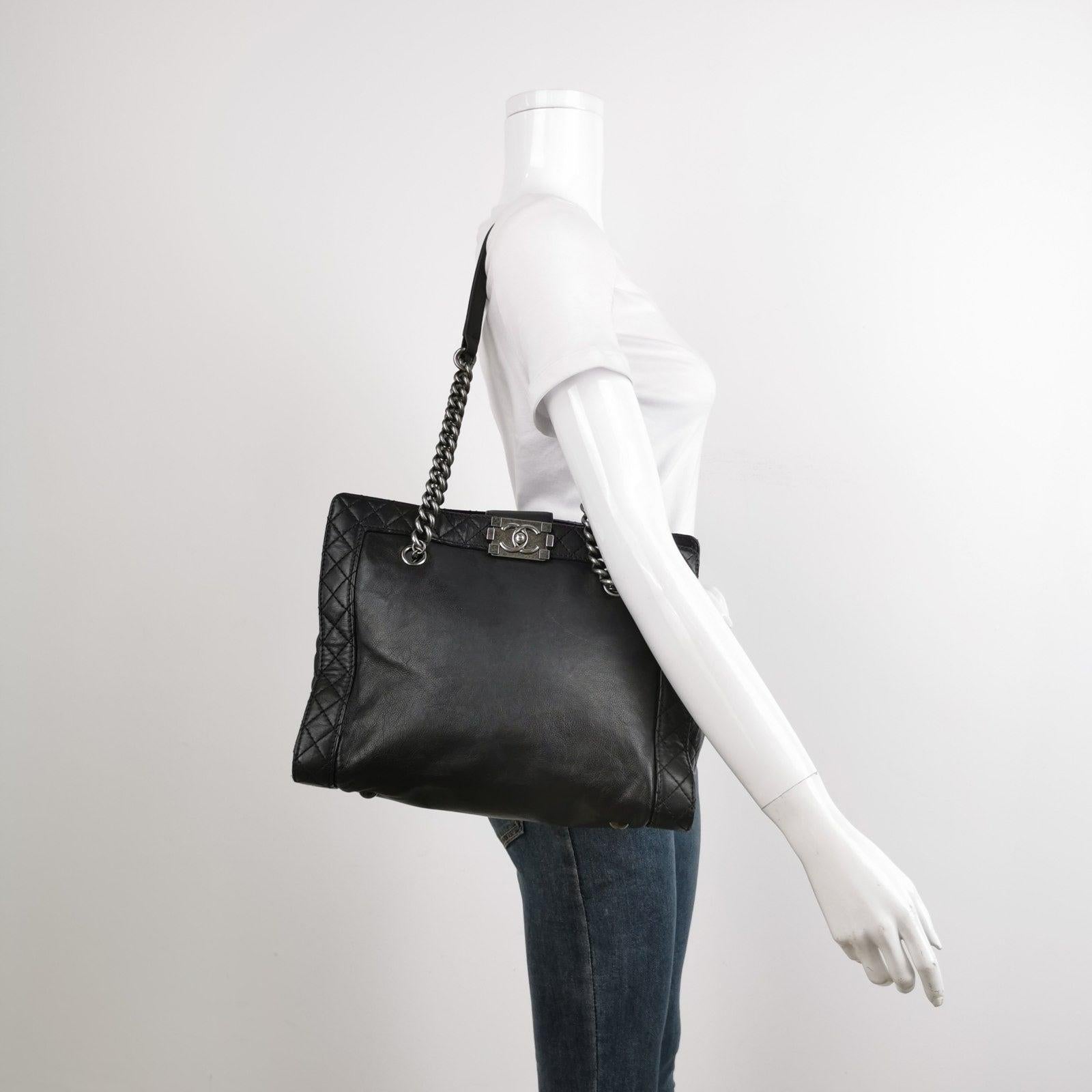Chanel Boy Reverso Shopping Tote Calfskin Leather Black
  These are professional photos of the actual bag.
  This stylish tote is expertly crafted from smooth calfskin leather and highlighted by diamond quilted trim and sides. The bag boasts