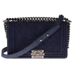 Chanel Boy shoulder bag in navy blue quilted suede caviar with silver hardware