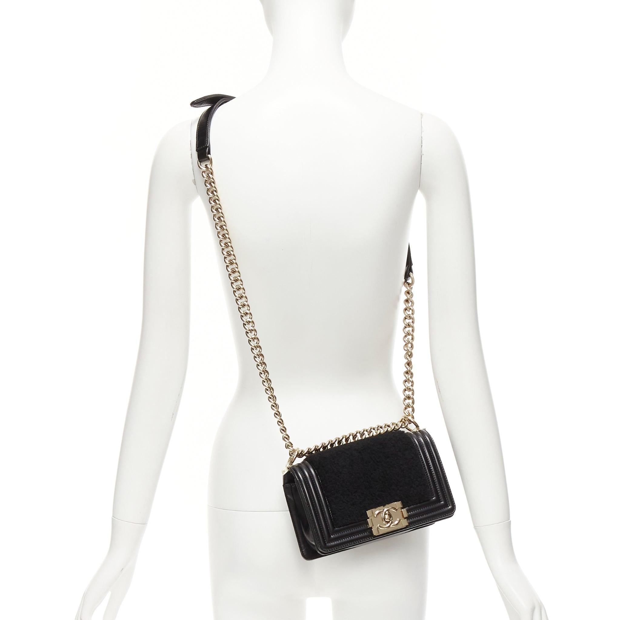 CHANEL Boy Small black shearling leather gold CC push lock chain flap bag
Reference: KYCG/A00035
Brand: Chanel
Model: Boy Small
Material: Leather, Shearling, Metal
Color: Black, Gold
Pattern: Solid
Closure: Push Lock
Lining: Black Leather
Extra
