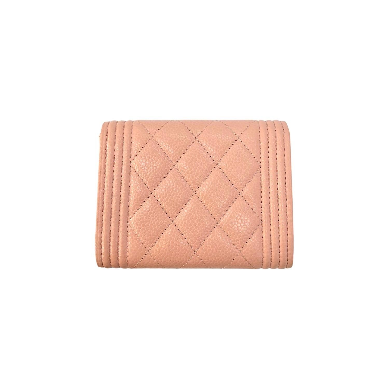 This Chanel Interlocking CC Trifold Wallet was made in Italy and it is finely crafted of pink quilted caviar leather with gold-tone hardware features. It has a fold over snap closure that opens up to a pink nylon interior with 3 pockets. It is also