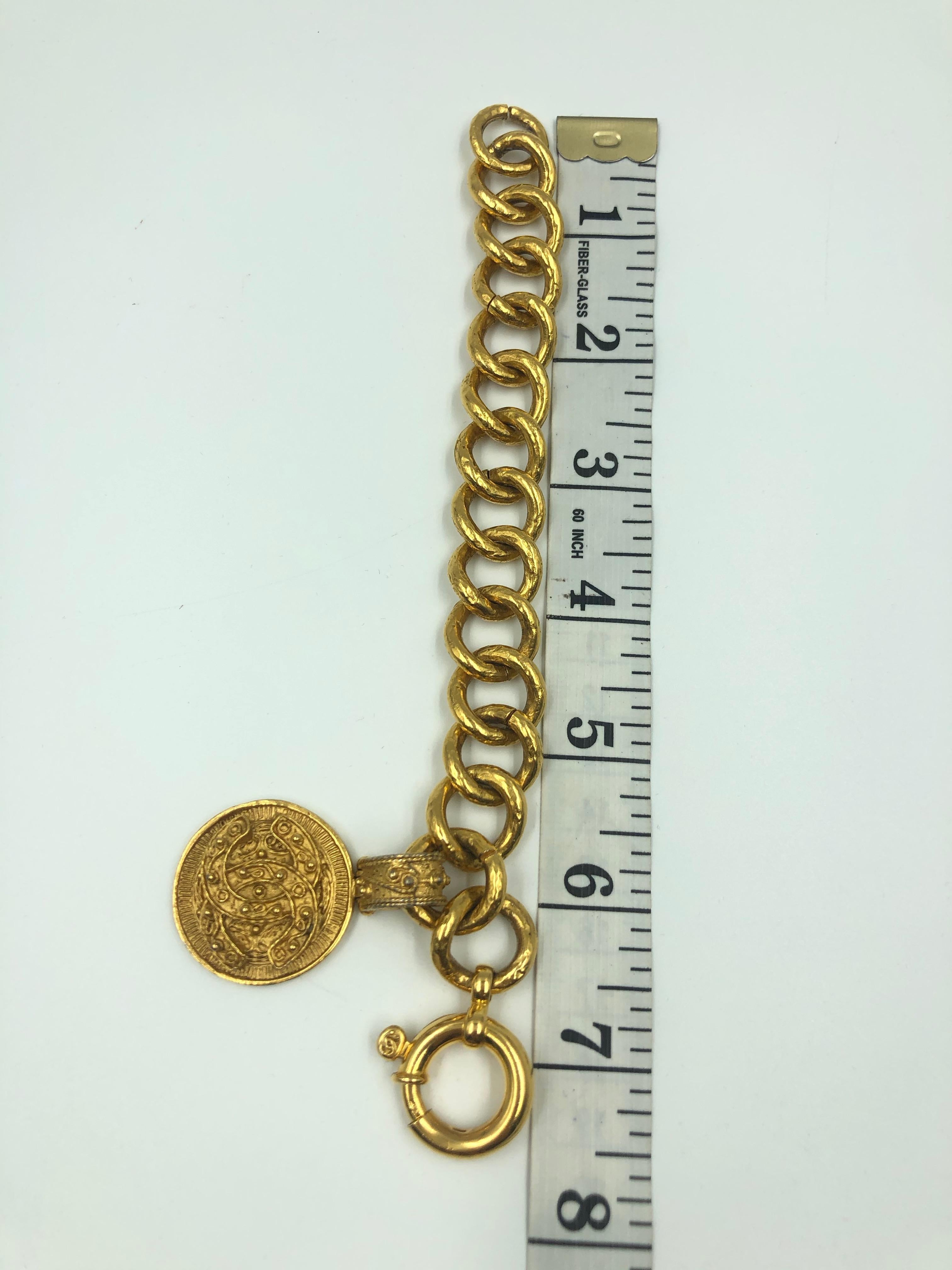Women's or Men's Chanel CC Logo Bracelet Gold Tone Filigree with a Hanging CC Medallion