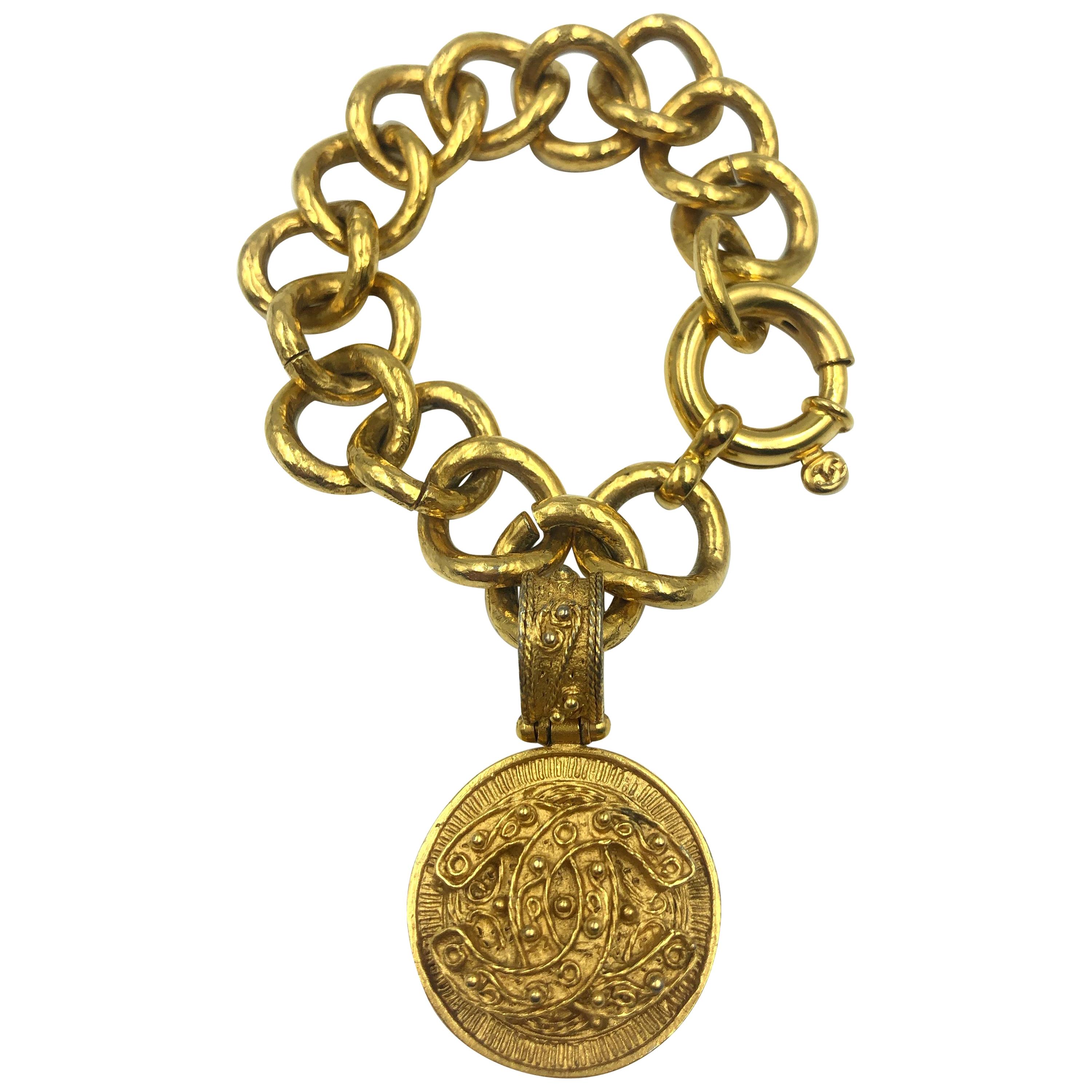Chanel CC Logo Bracelet Gold Tone Filigree with a Hanging CC Medallion