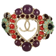 Bracciale Chanel in metallo champagne, resina e strass Cruise, 2009
