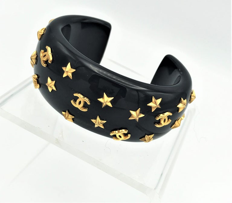 Chanel open bracelet, molded black acrylic signed 95 CC P with gold