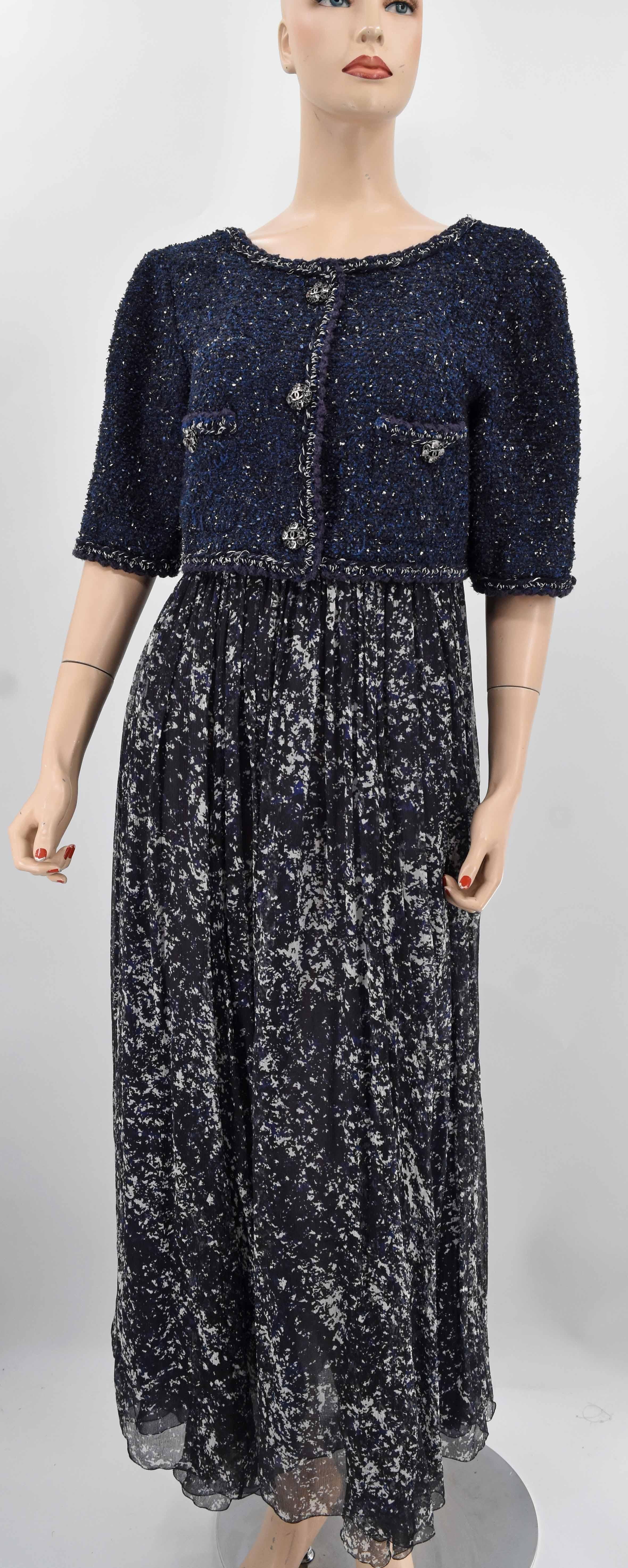 Chanel braided trim maxi dress adorned with interlocking CC logo buttons. This is pre-owned in excellent condition. It retails $13,620 before tax. Color is beautiful blend of navy blue and off white.