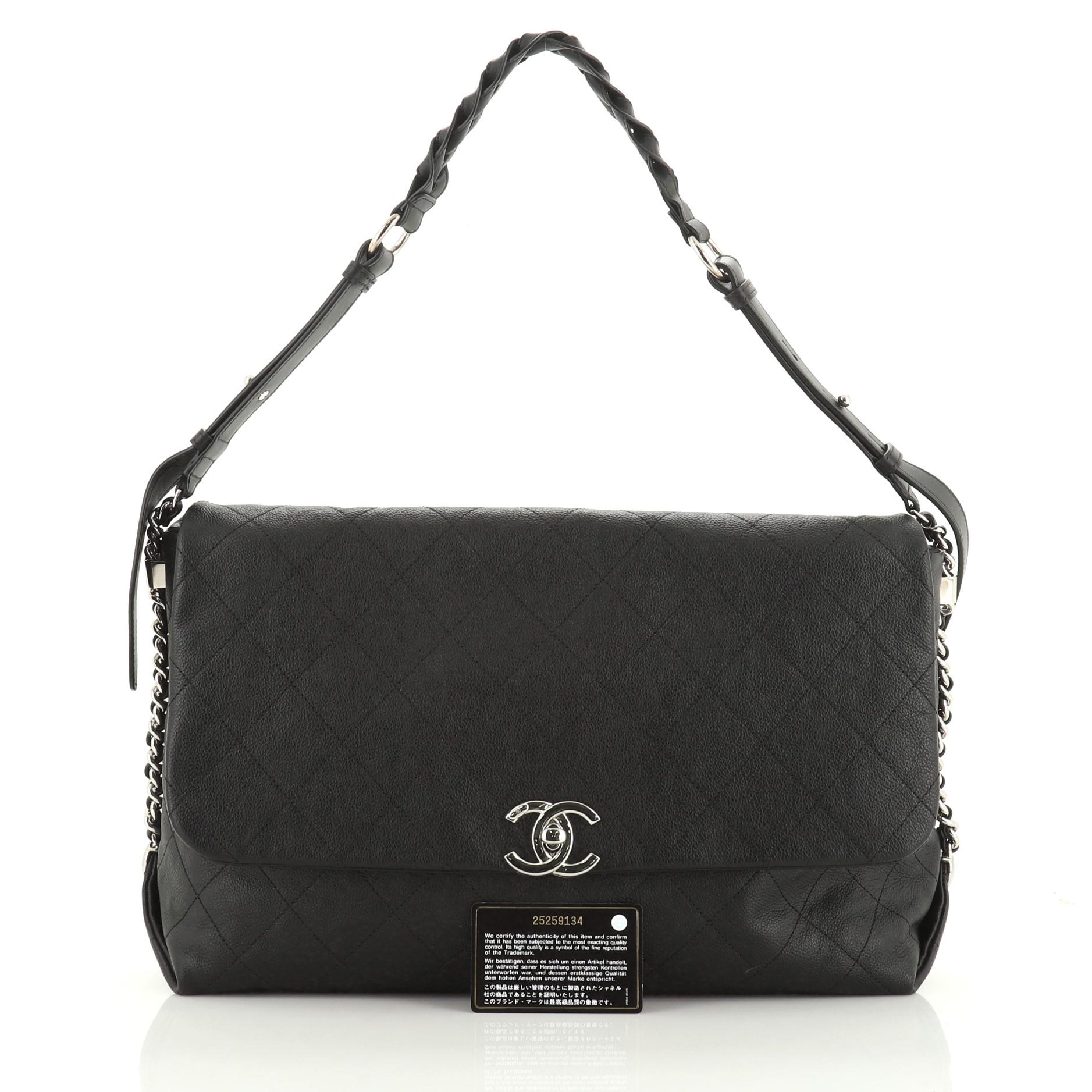 This Chanel Braided With Style Flap Bag Quilted Grained Calfskin Large, crafted in black leather, features braided adjustable shoulder strap and silver-tone hardware. Its CC turn-lock closure opens to a black fabric interior. Hologram sticker reads: