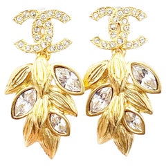 Chanel Brand New Gold CC Crystal Olive Leaf Dangle Piercing Earrings
