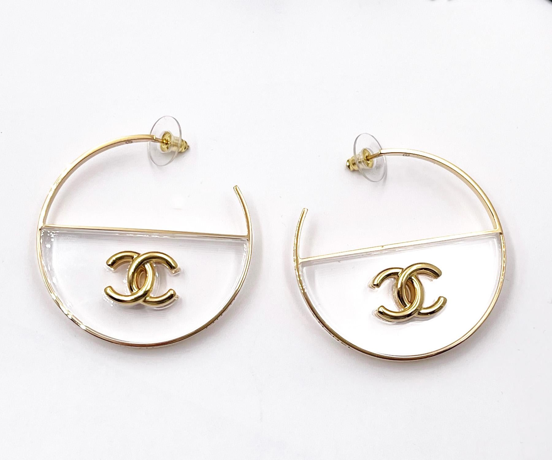Chanel Brand New Gold CC Transparent Large Hoop Earrings

* Marked 23
* Made in Italy
*Comes with the original dustbag, pouch, tag, booklet, ribbon and tag

- It is approximately 2