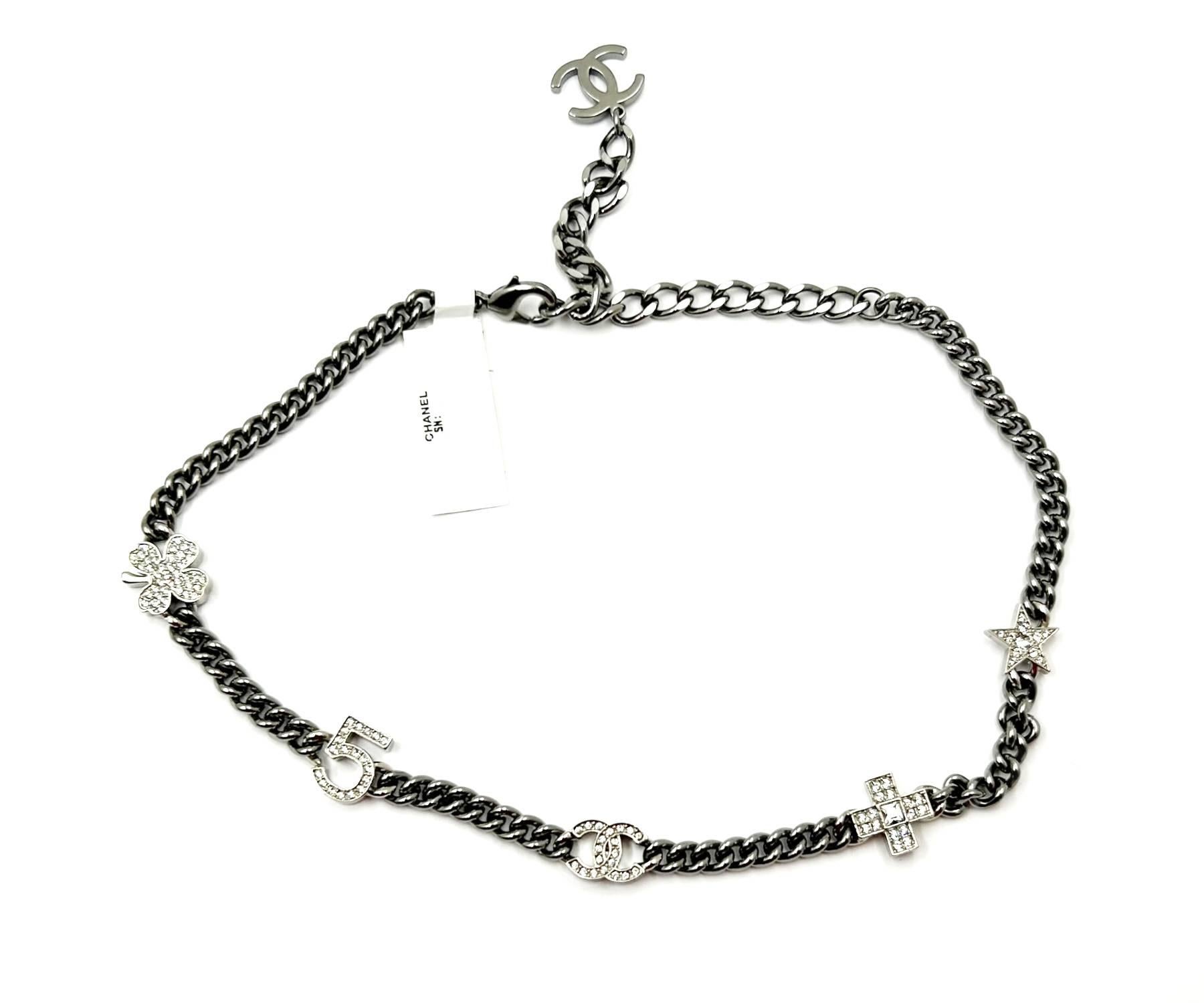 Chanel Brand New Silver 5 Crystal Charms Gunmetal Chain Choker Necklace

* Marked 23
* Made in France
* Comes with the original box, pouch, tag, booklet, ribbon and camellia
* Brand New

-It is approximately 13