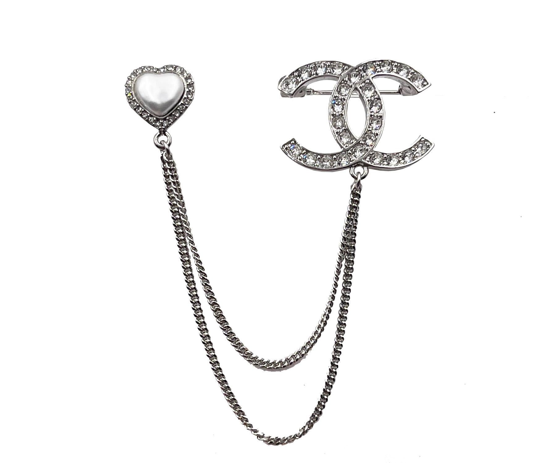 Chanel Brand New Silver CC crystal Heart Pin Link Brooch

* Marked 23
* Made in Italy
*Comes with the original box, pouch, tag, booklet, ribbon and camellia

-It is approximately 1.25