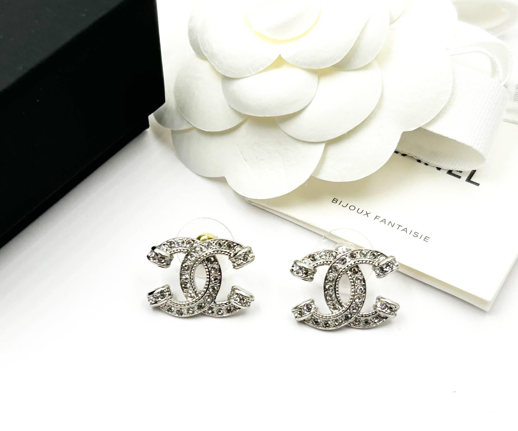 Chanel Brand New Silver CC Pillar Crystal Piercing  Earrings

*Marked 23
*Made in France
*Comes with the original box, pouch, booklet, ribbon and camellia flower
*Brand New

-It is approximately 0.9