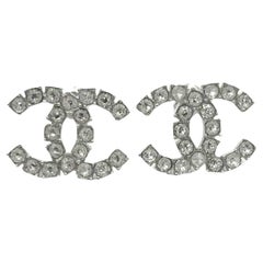 Chanel Brand New Silver CC Rocky Crystal Reissued Piercing Earrings  
