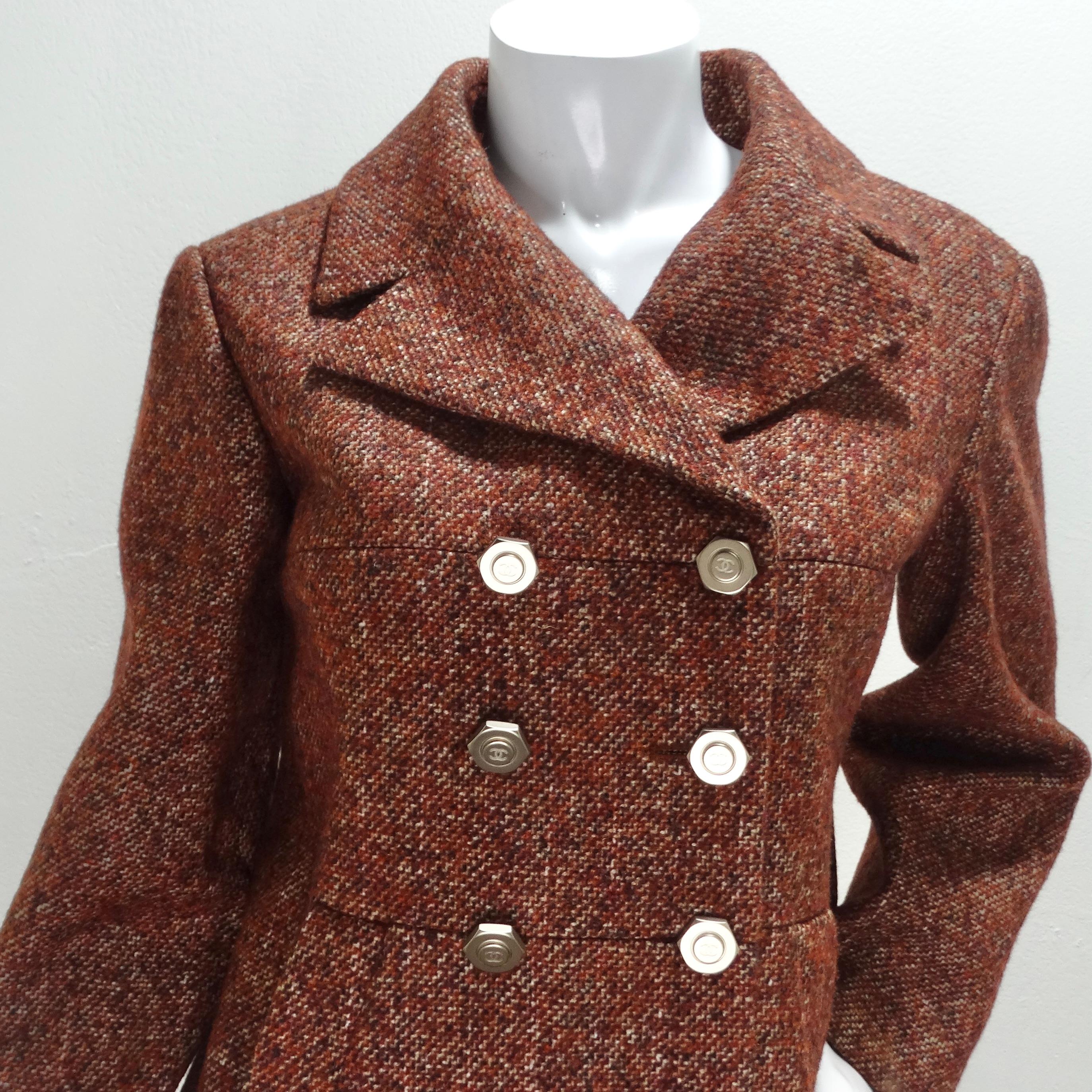 Elevate your wardrobe to new heights of sophistication with this Chanel Brand New Tweed Blazer. In a stunning warm brown/red tone tweed, this blazer is the epitome of classic Chanel elegance. The attention to detail is impeccable, with an array of