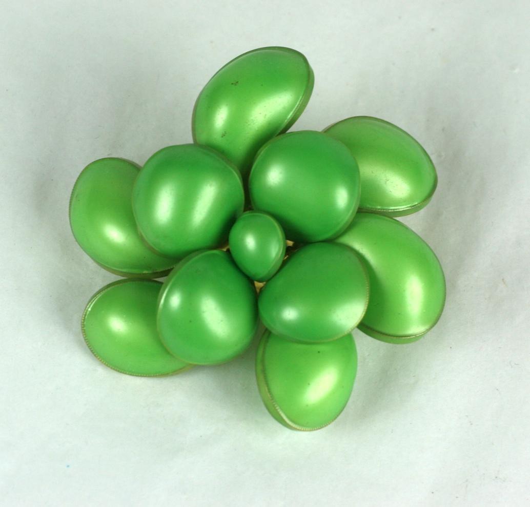 Unusual Maison Gripoix for Chanel poured glass signature  multi petal camellia pendant-brooch with bright lime green nacre lacquer by Victoire de Castellane for Maison Gripoix for Chanel. 
Excellent Condition, Unsigned. 
Length 2 1/8