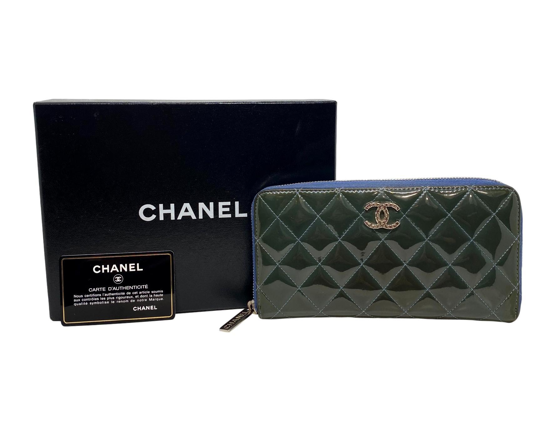 Chanel Brilliant Deep Marine Bi-color Patent Lambskin Leather Gusset Zip Wallet, 2011 - 2012. This classic Large Gusset zip wallet comes in iconic hand quilted patent lambskin leather in the rare deep marine coloration. Adorned with silver toned