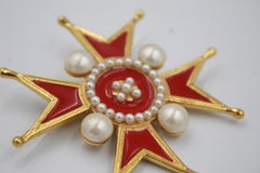 Chanel broche in gold metal, red enamel and fake pearl