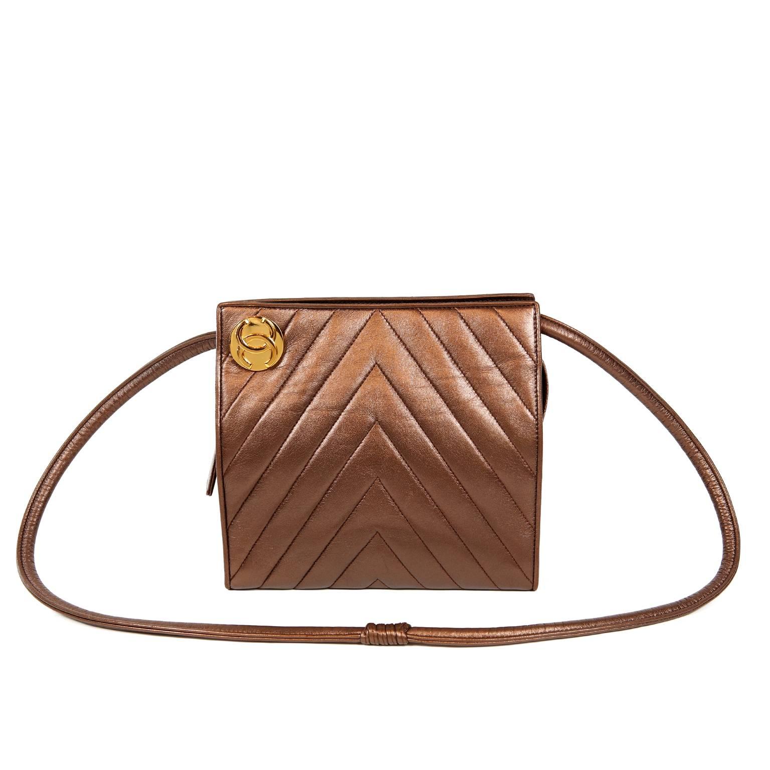 Chanel Bronze Leather Chevron Quilted Shoulder Bag- MINT
 A beautiful vintage Chanel piece, it appears possibly never carried.
Coppery bronze leather is quilted in chevron pattern.  Large gold interlocking CC medallion sits atop one corner. 
