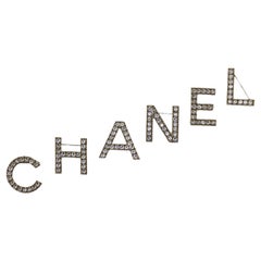 Vintage CHANEL Brooch  "C H A N E L"