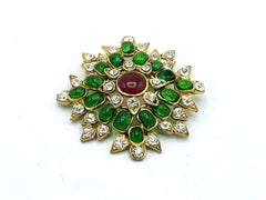 CHANEL BROOCH, green and red Gripoix glass, rhinestons, signed 1970/80, France