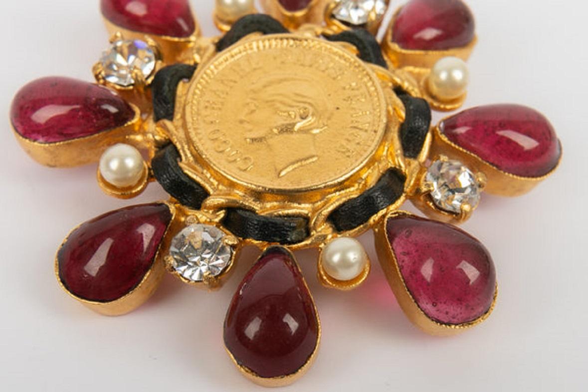 Women's or Men's Chanel Brooch in Gold Metal, Black Leather, Rhinestones and Red Glass Paste For Sale