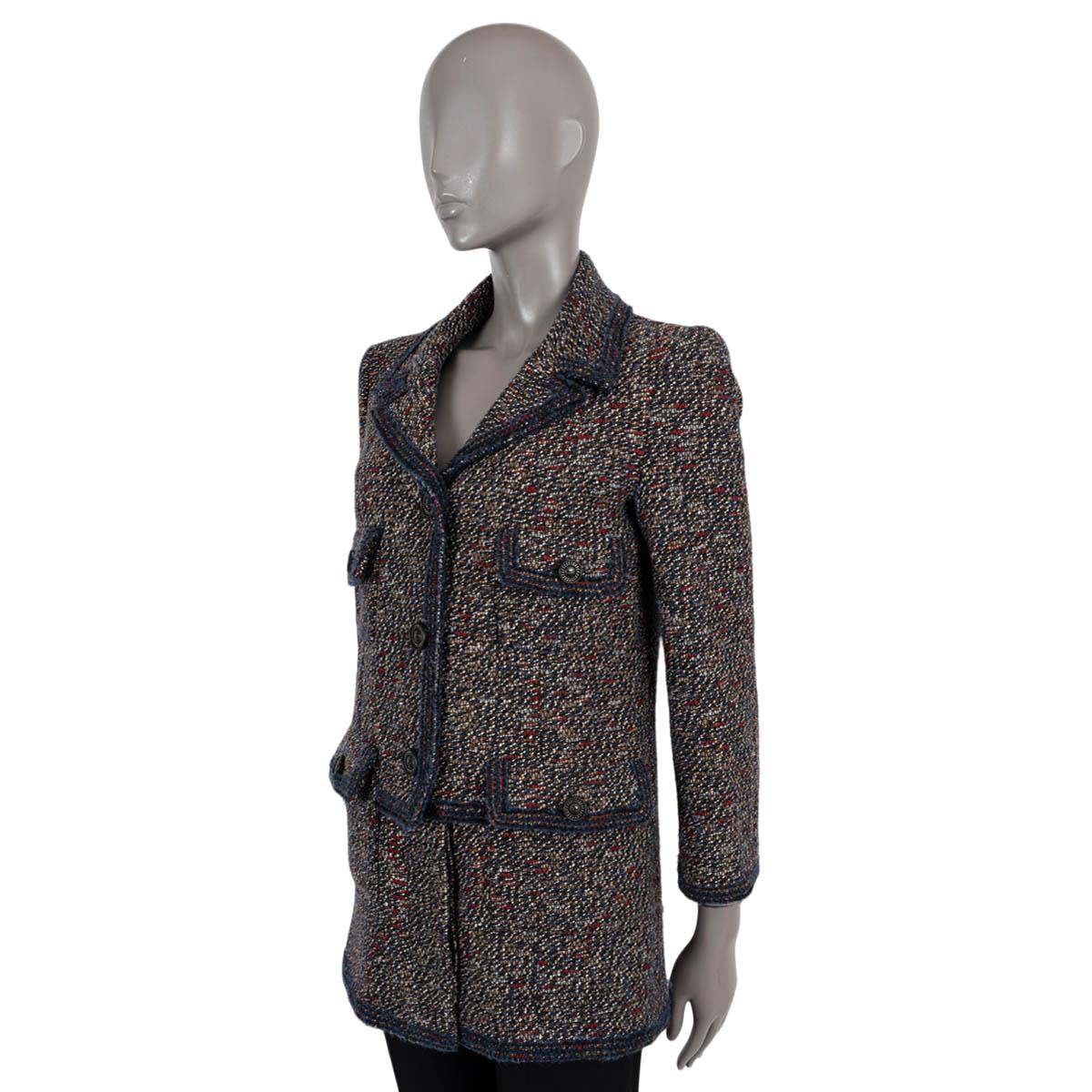 100% authentic Chanel tweed jacket in black, brown, navy and red wool (60%), nylon (26%), mohair (7%) and alpaca (7%). Features four flap pockets, a peak lapel and a split bottom hem. Closes with metal buttons on the front and is lined in silk