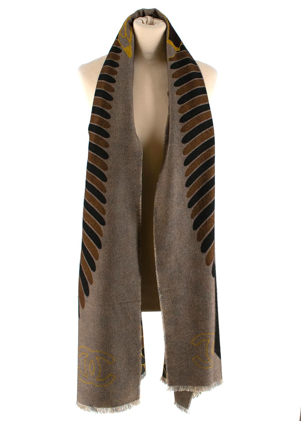 Chanel Brown & Black Cashmere Coco Wings Paris/Egypt Stole

-From the popular Paris/Egypt collection showcasing famous Egyptian heiroglyphics
-Luxuriously soft cashmere texture
-Intricately detailed winged Coco Chanel printed on one side
-Stunning