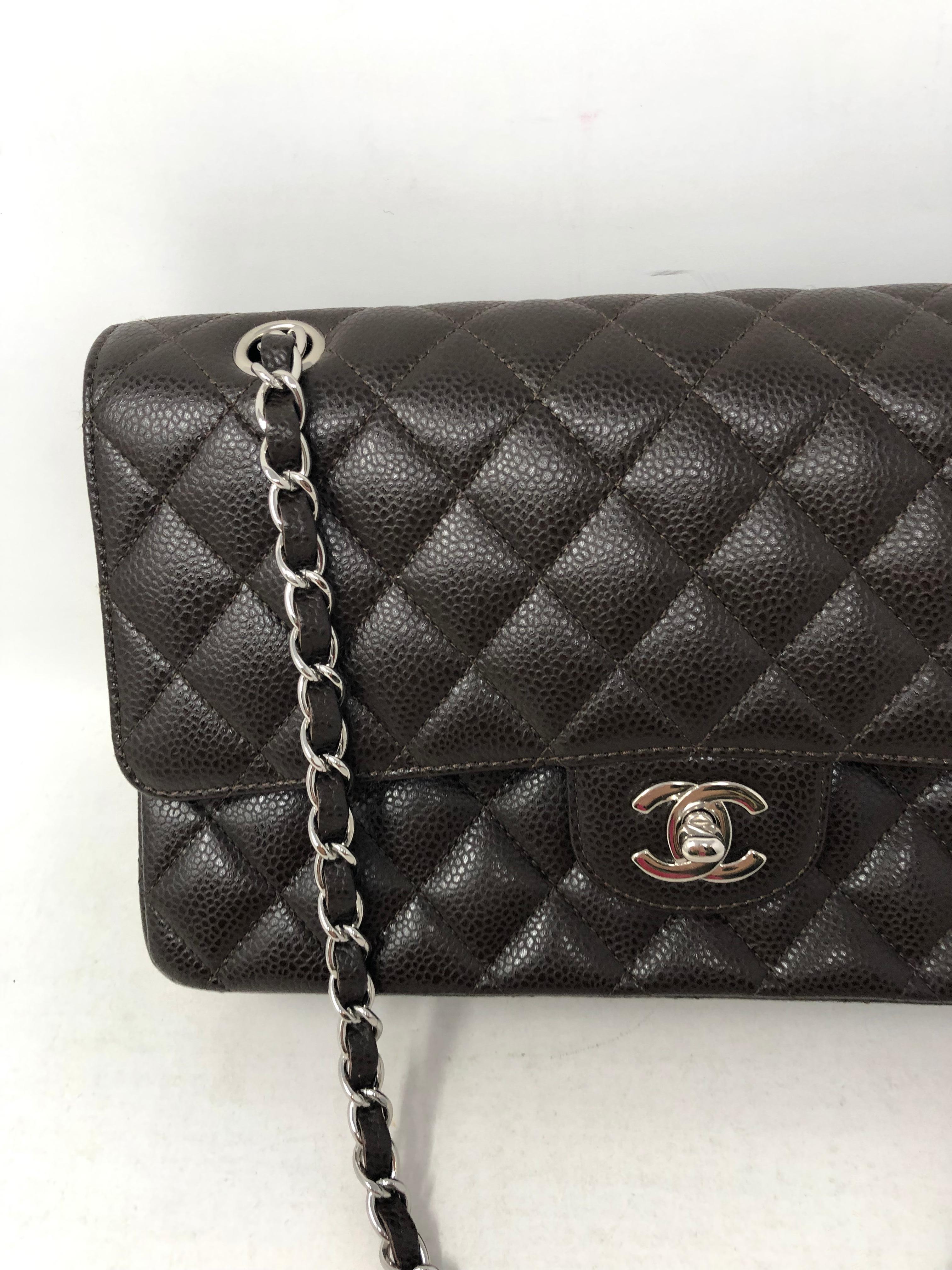 Chanel Brown Caviar Leather Double Flap Bag. Silver hardware. Mint like new condition. Dark brown caviar leather. Classic style and most wanted size, medium 10
