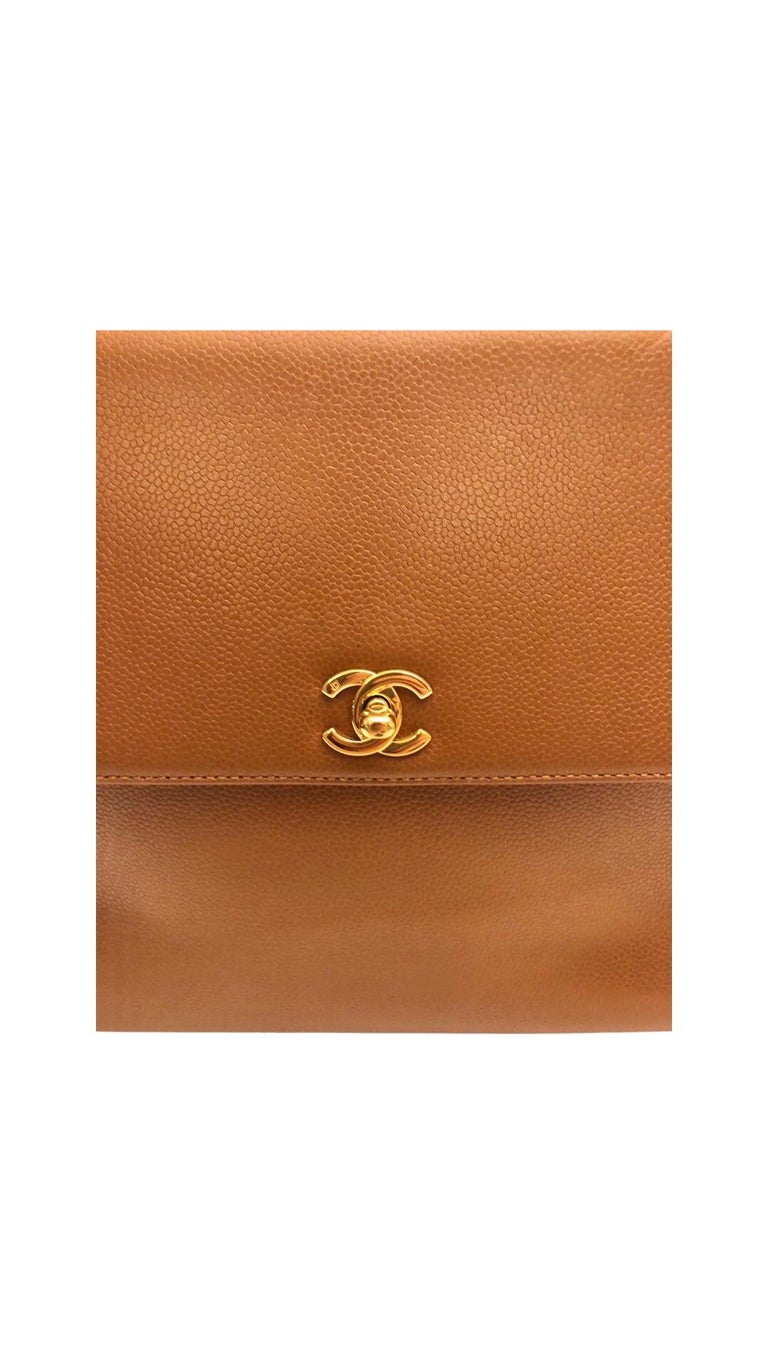 - Vintage Chanel brown caviar “Kelly” bag.

- Circa 1997-1999

- Gold plated hardware with iconic 'CC' front closure. 

- Comes with original authenticity card, sticker and dust bag. 

- 30 cm x 24 cm x 12 cm

