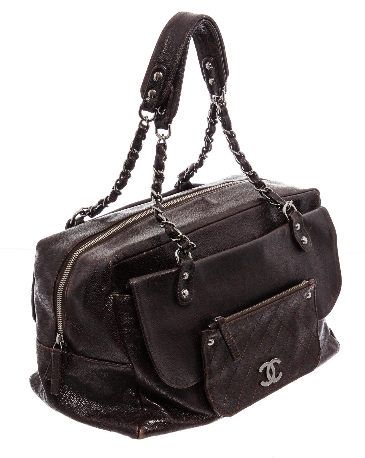 Brown quilted caviar leather Chanel Pocket In The City Flap Bag with antiqued silver-tone hardware, dual pockets at exterior; one with CC adornment, dual chain-link and leather shoulder straps, three interior compartments; dual with fold-over flap