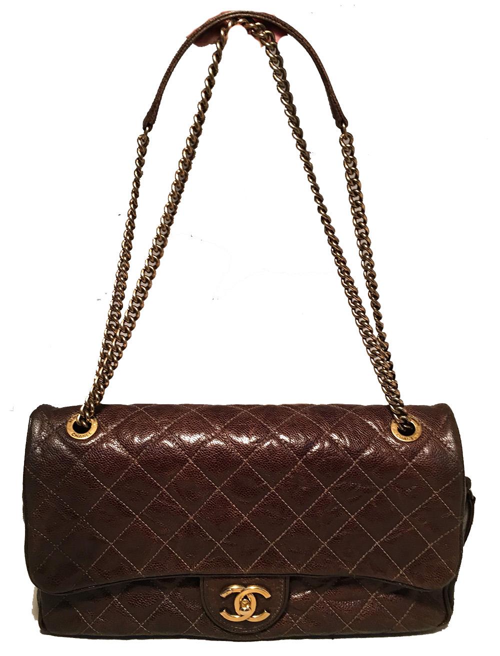 Chanel Brown Distressed Caviar Leather Quilted Classic Flap Shoulder Bag in excellent condition. Brown quilted distressed caviar leather exterior trimmed with antiqued gold hardware. Front CC logo twist closure opens via single flap and top zipper