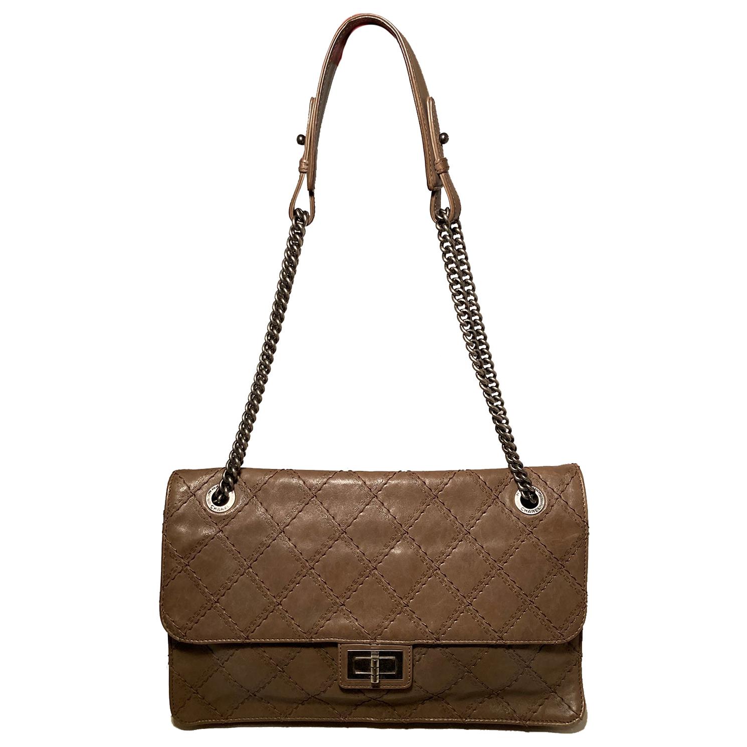 Chanel Brown Embossed Quilted Leather Classic Flap in excellent condition. Brown quilted leather exterior with embossed CC logo along quilting. Ruthenium hardware and double chain shoulder strap with leather center. Mademoiselle twist closure opens