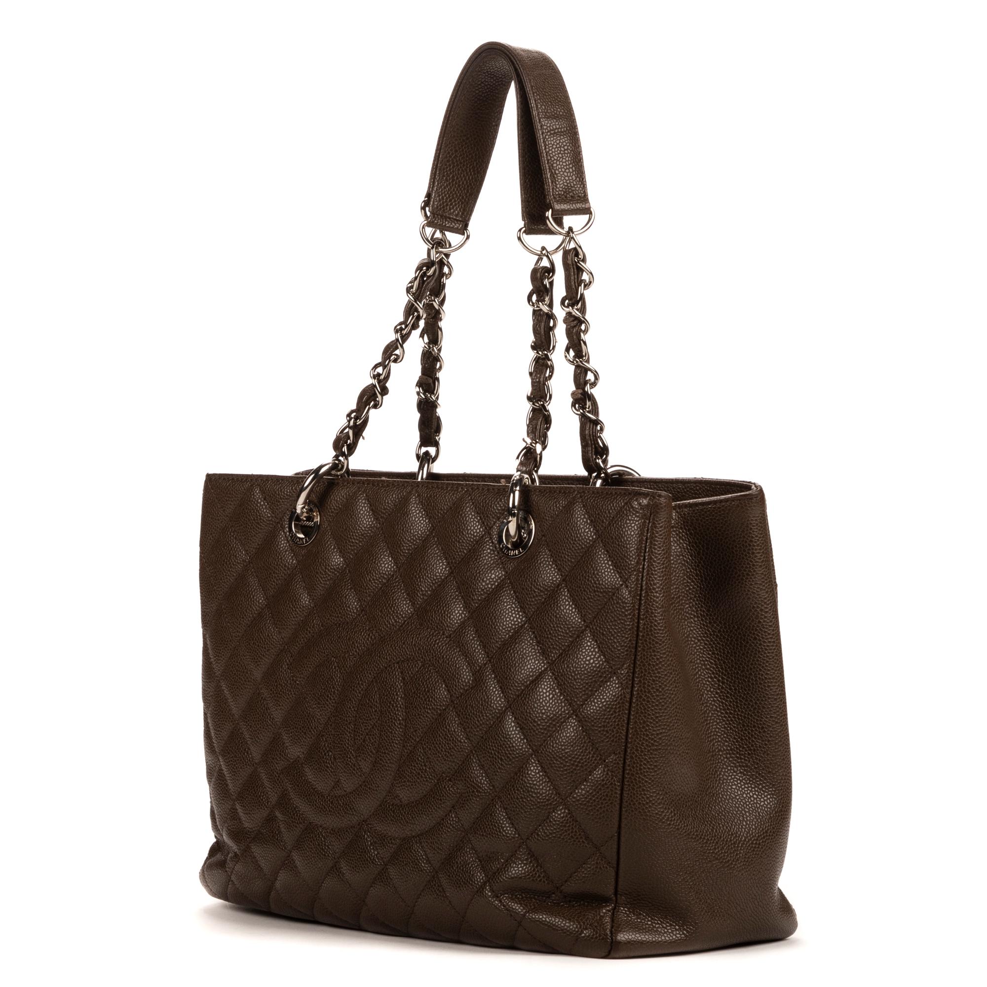 Introducing the Chanel Brown Grand Shopper: a fusion of practicality and luxury. Crafted from durable caviar leather in a rich brown hue, this spacious tote is your everyday essential. Its sleek silver hardware adds a touch of refinement, while the