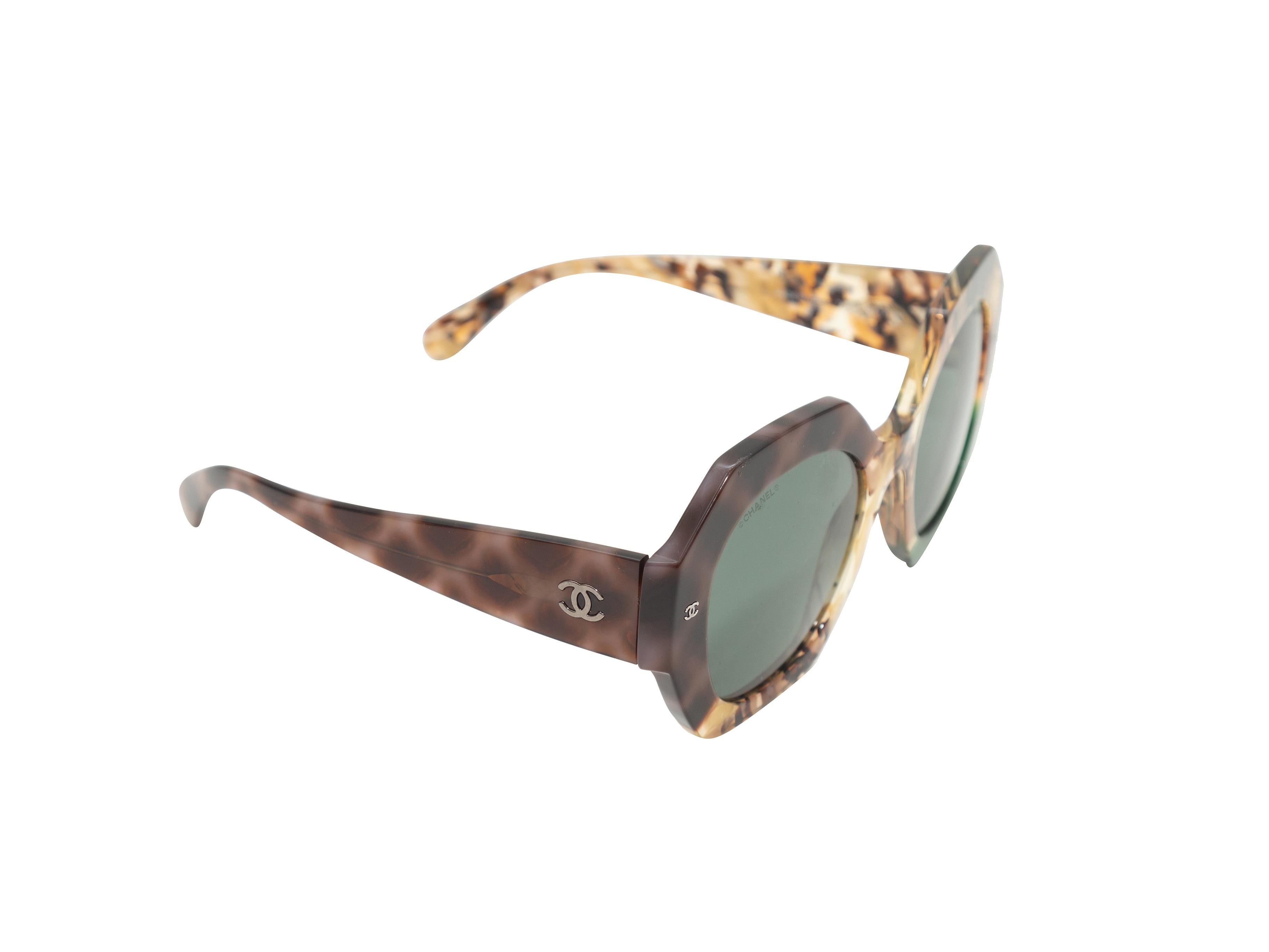 Product details: Brown and green oversize heptagon sunglasses by Chanel. Grey tinted lenses. 2.5
