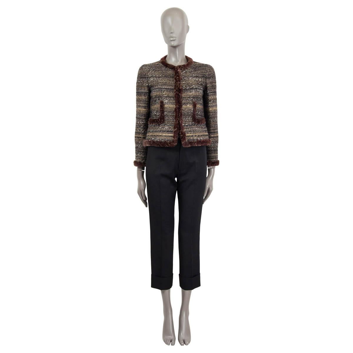 100% authentic Chanel cropped tweed jacket in black, grey, brown and gold lurex wool (55%), polyamide (23%), silk (13%), mohair (18%) and metal (1%). Features a rabbit fur trim in melange brown and beige amd two pockets on the front. Jacket opens