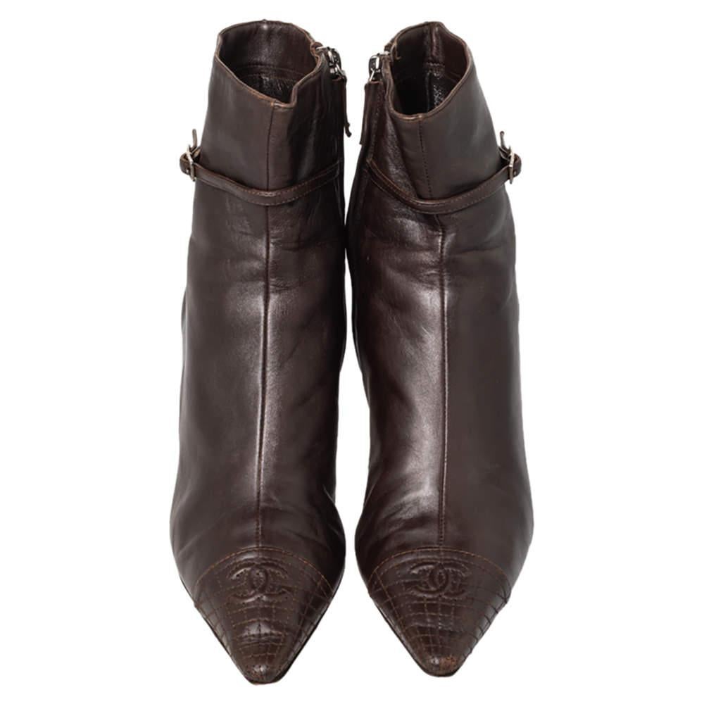 Your dream of owning a pair of Chanel boots can come true with these ones that are hard to miss! They are crafted from brown leather in a pointed toe silhouette and designed with the signature quilted pattern on the capt-toes & counters. They