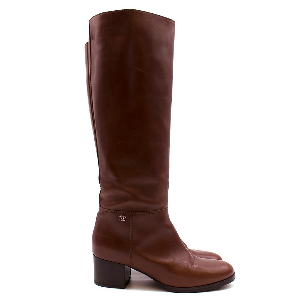 Chanel Brown Leather Tall Boots

High leather boots in brown 
Iconic CC silver hardware on the ankle of boots
Stacked heel
Pull on boots 

Alternative dust bag included.

Please note, these items are pre-owned and may show some signs of storage,