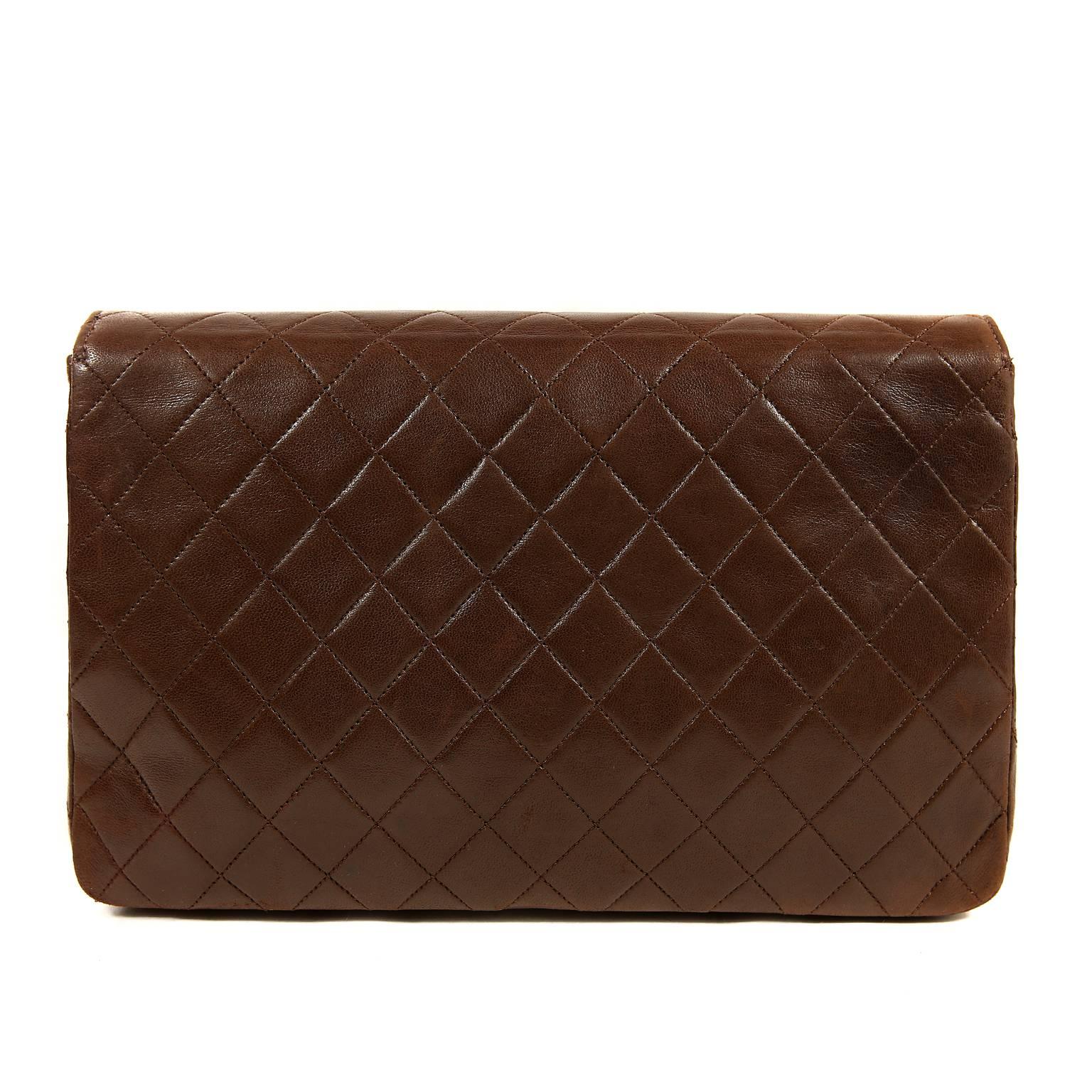 Chanel Brown Leather Medium Flap Bag- Excellent Plus Vintage Condition
  Classic and versatile, the shoulder strap tucks inside for clutch wear.
Rich brown leather is quilted in signature Chanel diamond pattern.  A gold interlocking CC twist lock