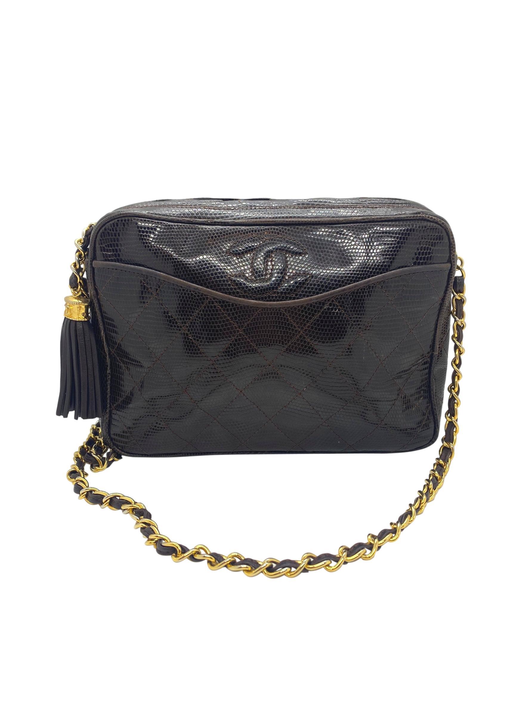 Chanel Brown Lizard Vintage Camera Tassel Bag with Gold Hardware. This extremely rare and highly sought after piece of Chanel history was one of the very first camera bags produced, baring a serial code of 
