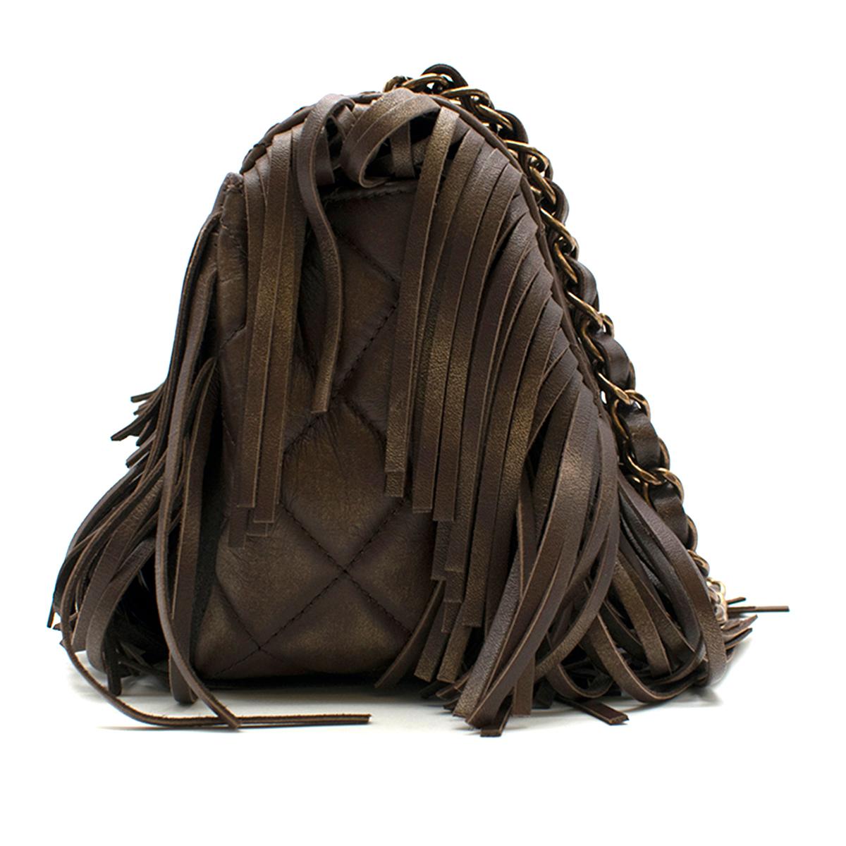 Chanel Brown Paris-Dallas Fringe Flap Bag

-Brown flap bag from the Paris-Dallas collection
-Quilted flap bag with tassel detailing
-Gold toned hardware
-Gold sheen to the leather
-Twist 'CC' clasp
-One main interior pocket with one zipped