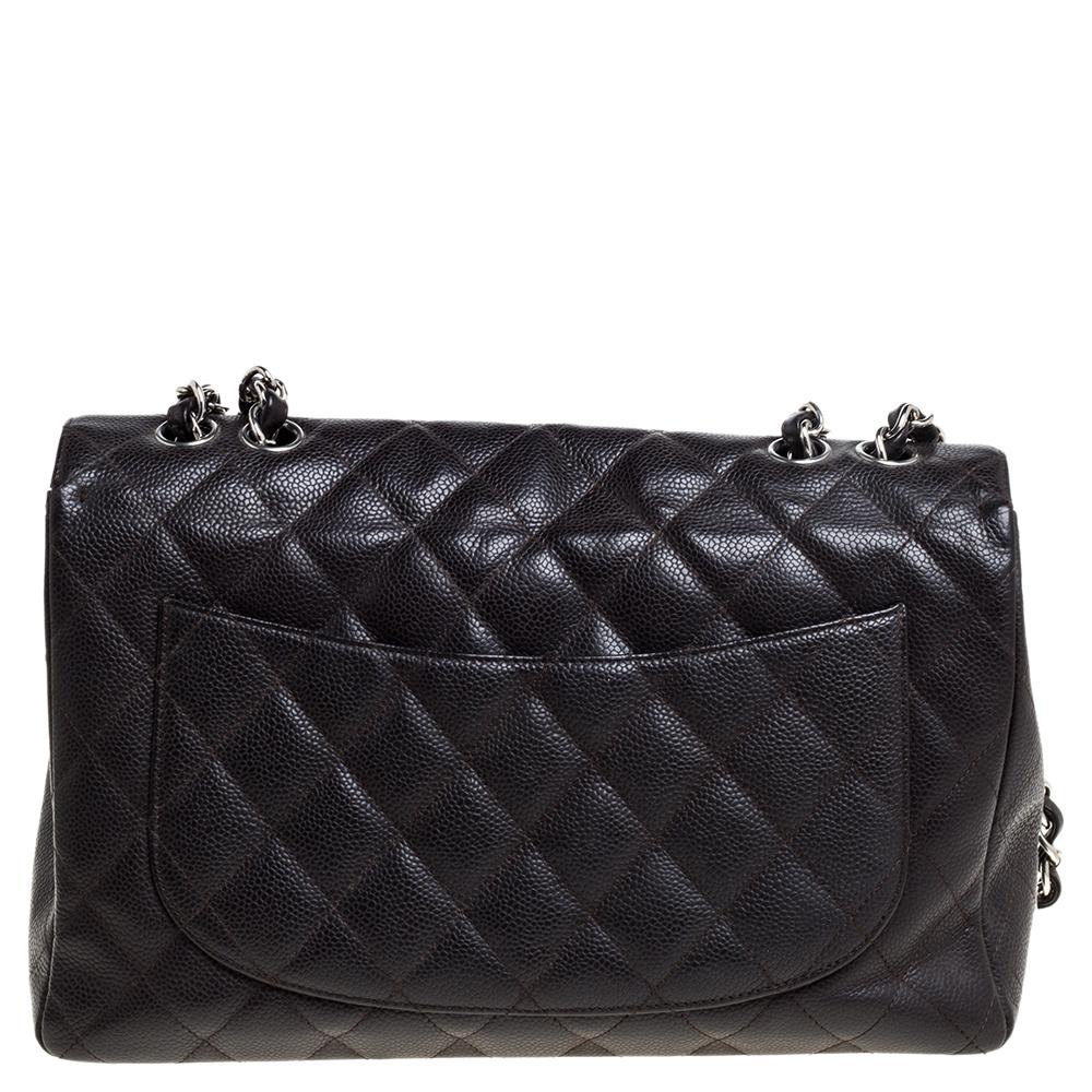 Chanel's Flap bags are the most iconic handbags. The caviar leather construction features a well-known quilted pattern. It has a chain-leather woven strap along with a CC twist lock flap closure in silver-tone. The single flap opens to a