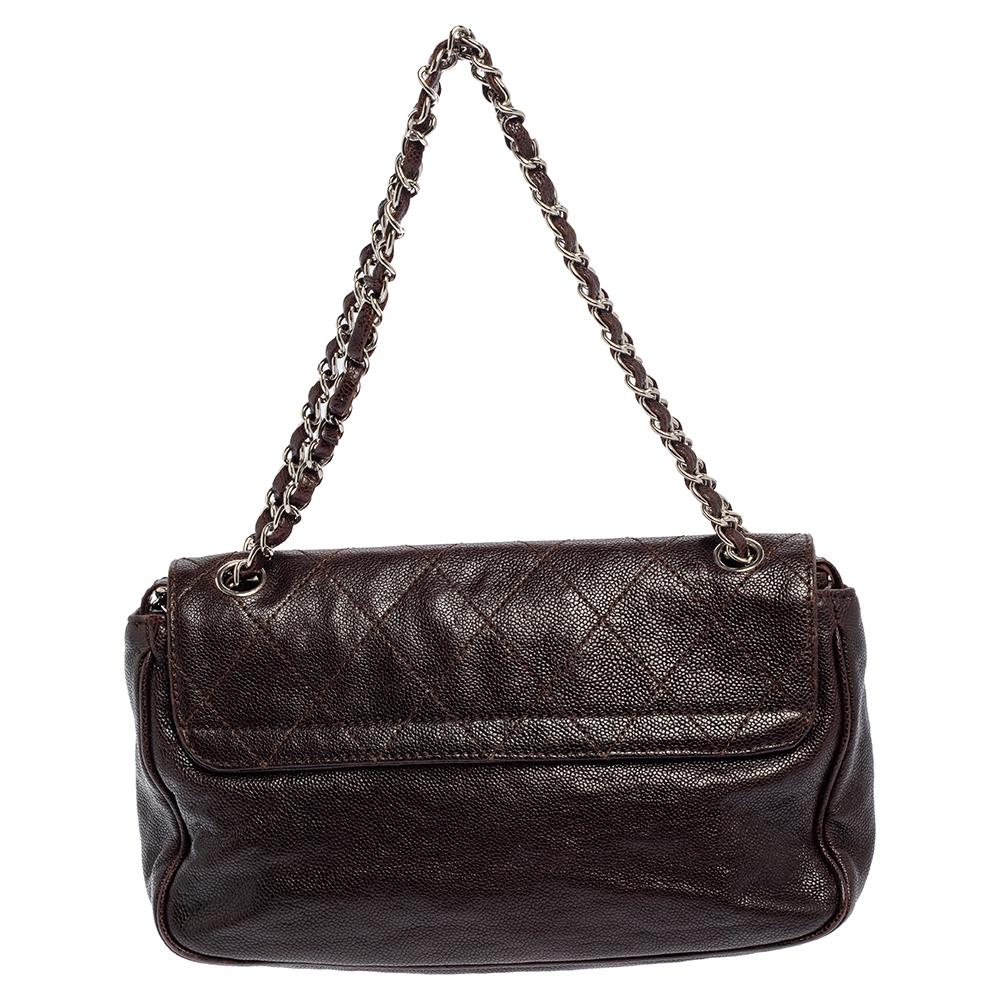 Introduce Chanel's irreplaceable style with this Reissue flap bag. Crafted using Caviar leather, the bag has a signature quilted exterior, the Mademoiselle lock on the flap, and a satin-lined interior. Complete with a chain link, this bag will be a