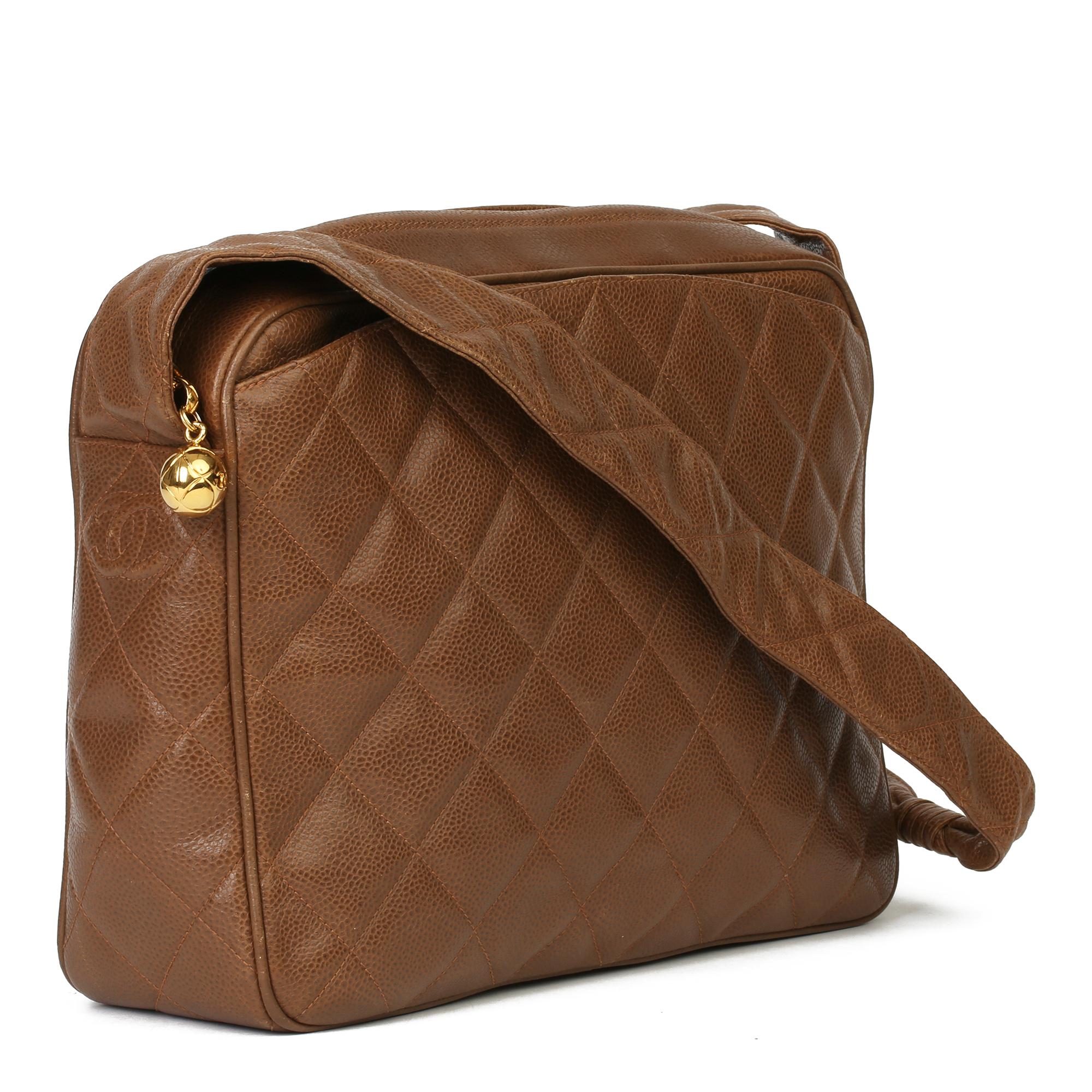 CHANEL
Brown Quilted Caviar Leather Vintage Timeless Camera Bag

Serial Number: 2943780
Age (Circa): 1994
Authenticity Details: Serial Sticker (Made in Italy) 
Gender: Ladies
Type: Shoulder

Colour: Brown
Hardware: Gold
Material(s): Caviar